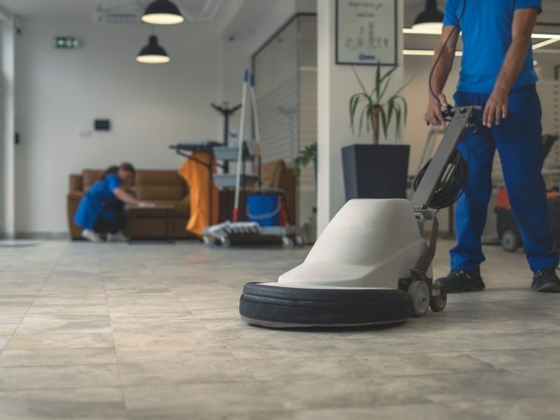 Worker,Polishing,Hard,Floor,With,High,Speed,Polishing,Machine,While
